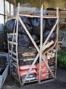 Justin has loaded a pallet of leaves, pots, bits of wood etc