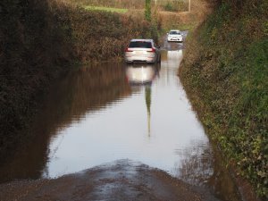 third car to have been abandoned in this gigantic puddle